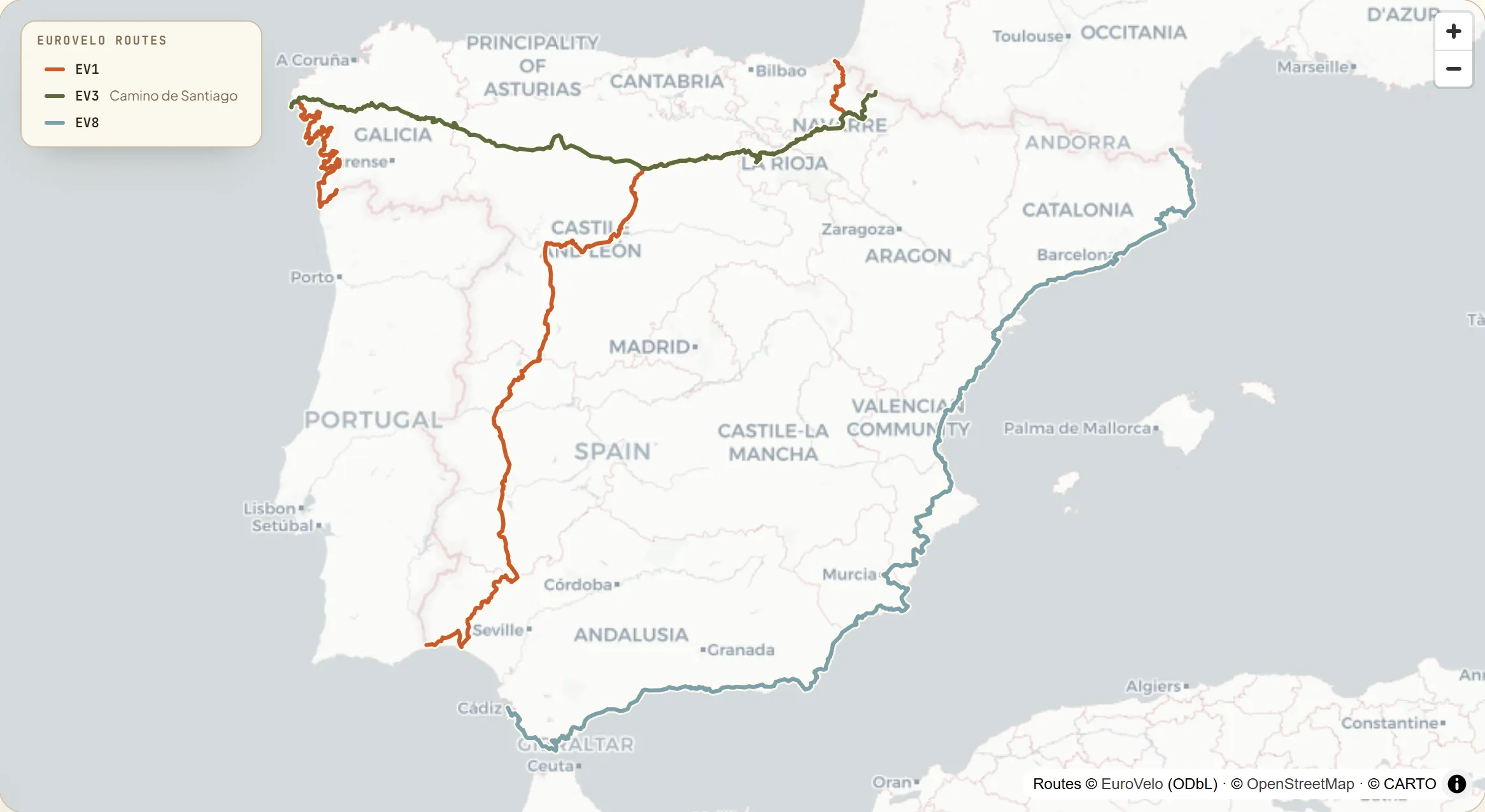 Map of mainland Spain with the three signed EuroVelo routes each drawn in its own colour — the Atlantic Coast down the west, the Camino de Santiago across the north, and the Mediterranean coast down the east.