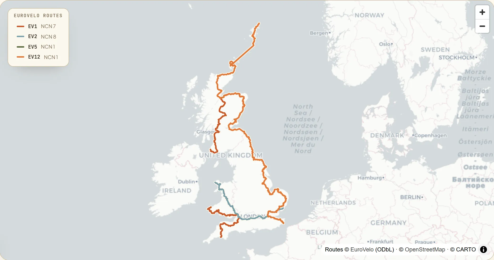Map of Great Britain with four signed EuroVelo routes — the North Sea Cycle Route (EV12) hugging the whole east coast from Dover to the Shetland Islands, the Atlantic Coast Route (EV1) running the Scottish Highlands and the Devon and Wales south-west, the Capitals Route (EV2) on a diagonal from Holyhead to Harwich, and the short Via Romea (EV5) from Canterbury to Dover.