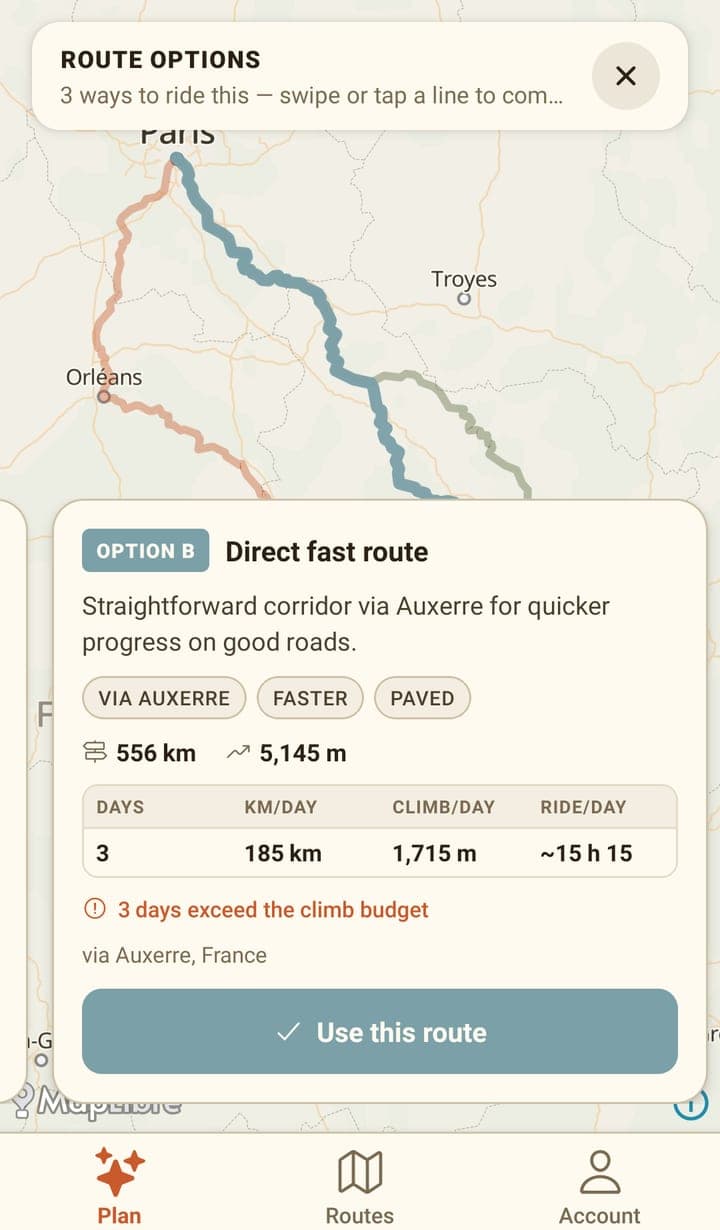 The route options picker: three coloured route lines between Paris and Orléans, and a card for 'OPTION B — Direct fast route' via Auxerre at 556 km and 5,145 m, with a per-day table, a warning '3 days exceed the climb budget' and a 'Use this route' button.