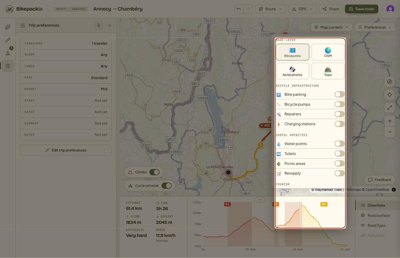 The Map content menu open, with a BASE LAYER group offering Bikepackia, OSM, Aerial photos and Topo, then toggles grouped under BICYCLE INFRASTRUCTURE (Bike parking, Bicycle pumps, Repairers, Charging stations), USEFUL AMENITIES (Water points, Toilets, Picnic areas, Resupply) and TOURISM.